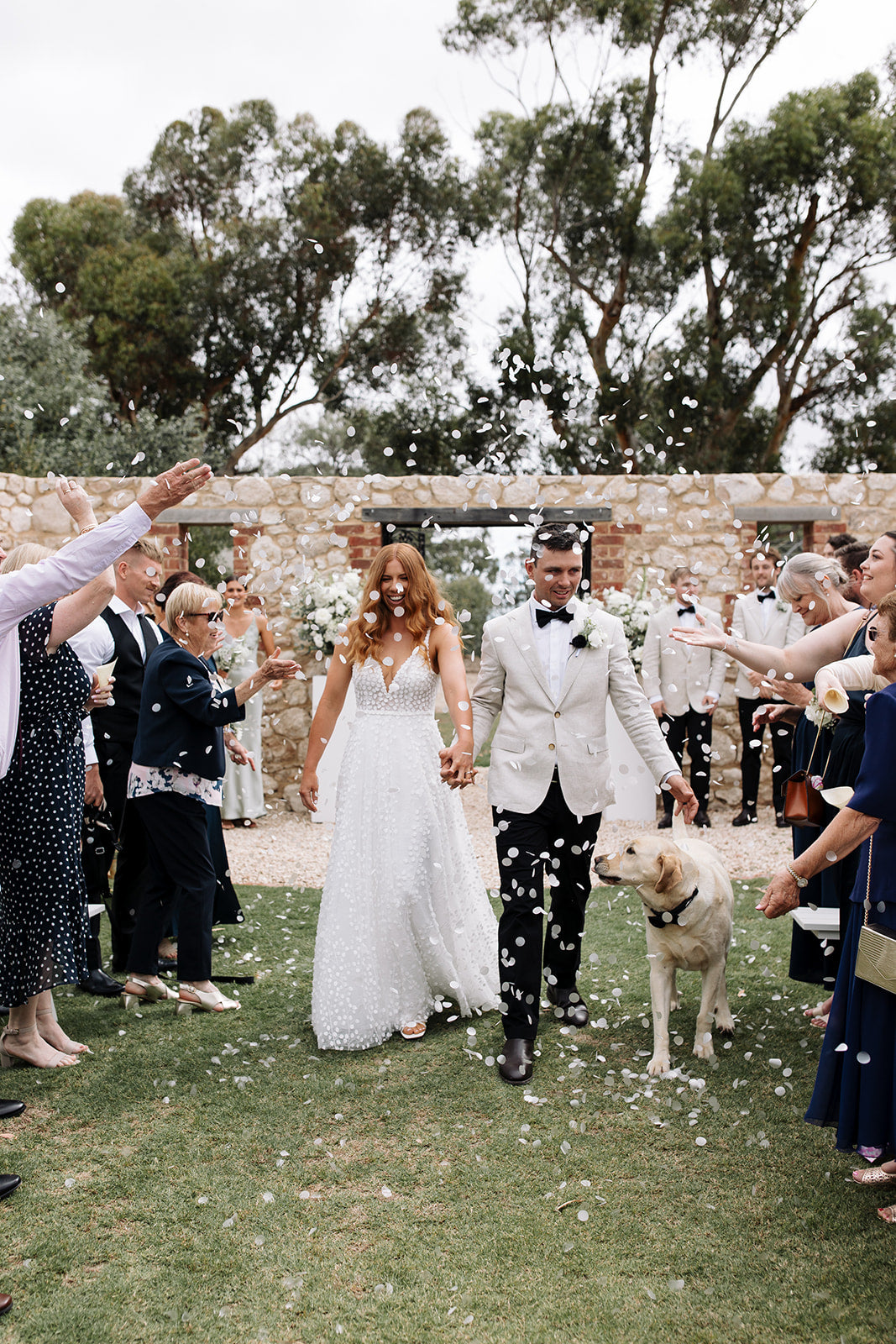 Confetti Aisle Walk with their dog.