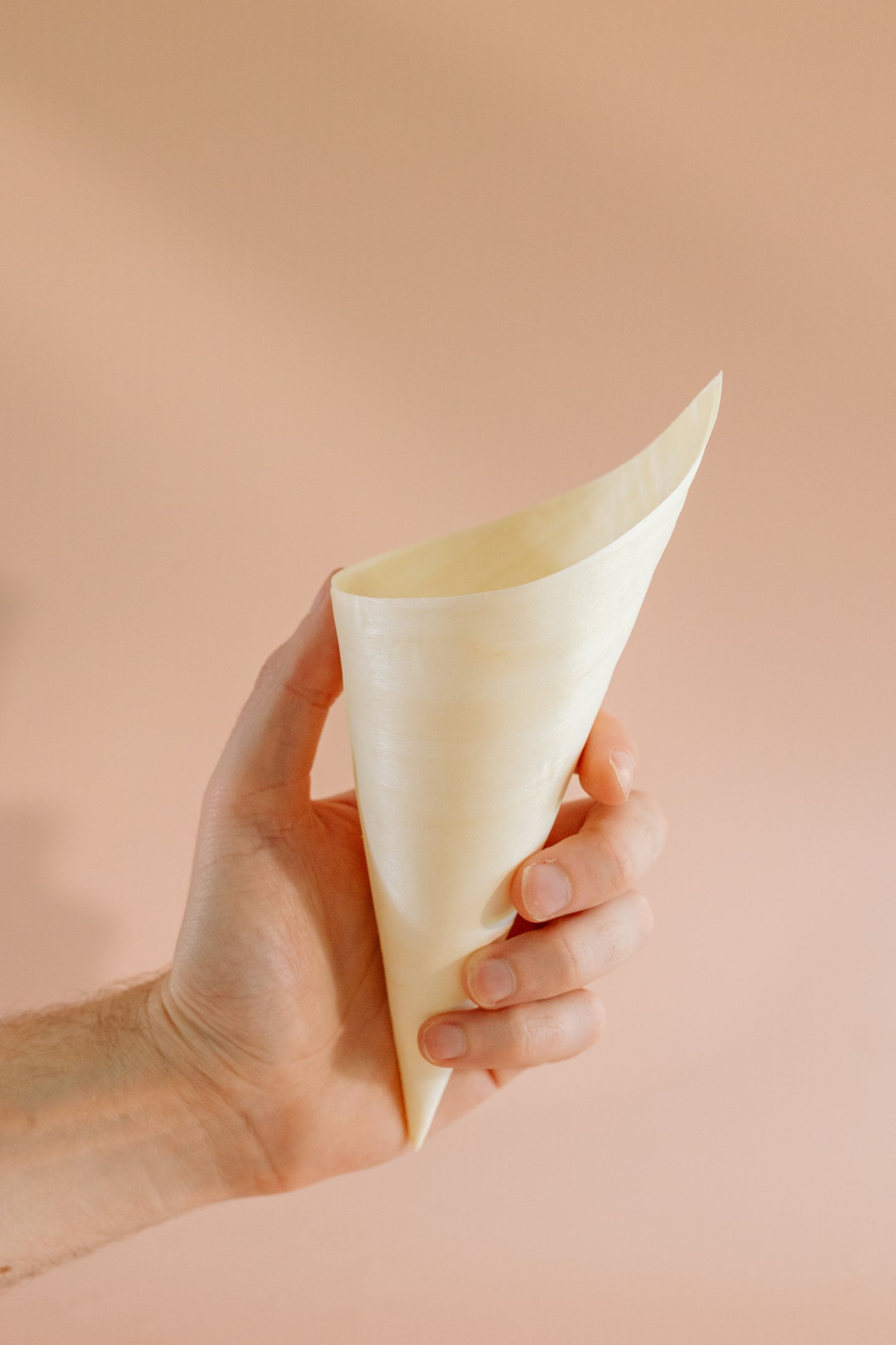 Holding a confetti cone