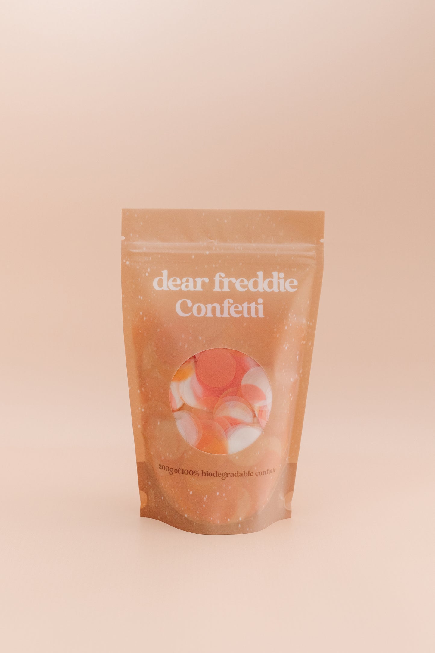 Smaller white, pink and orange confetti bag.