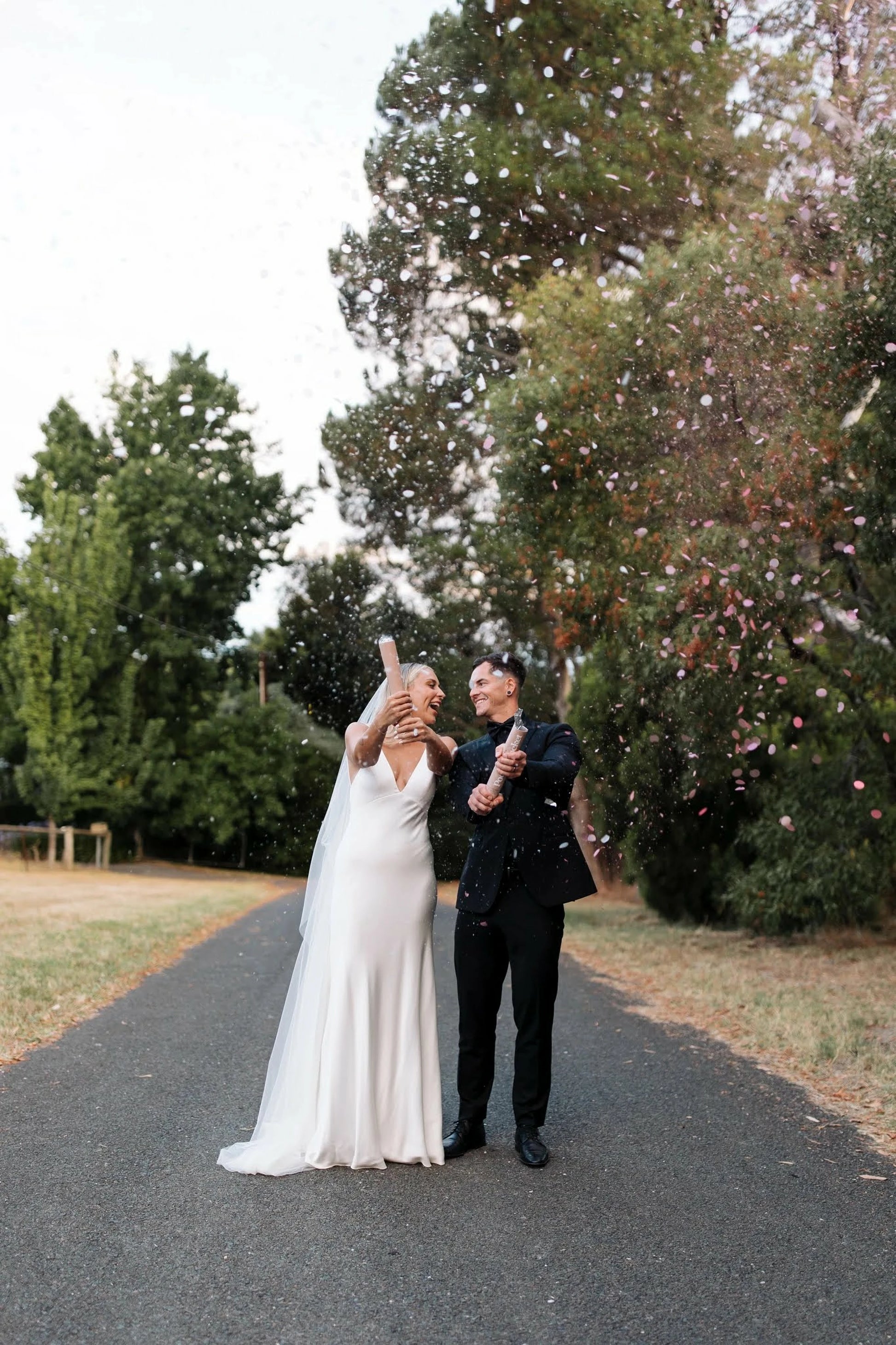 Couple using confetti cannon.
